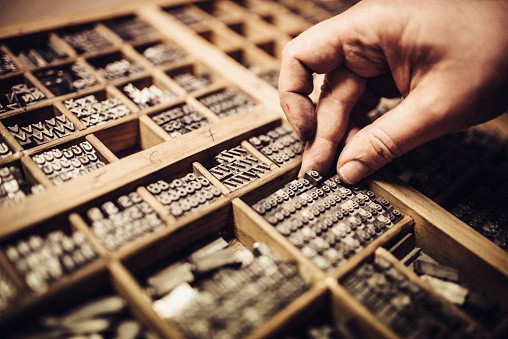 Artisan composing movable type for Letterpress Printing